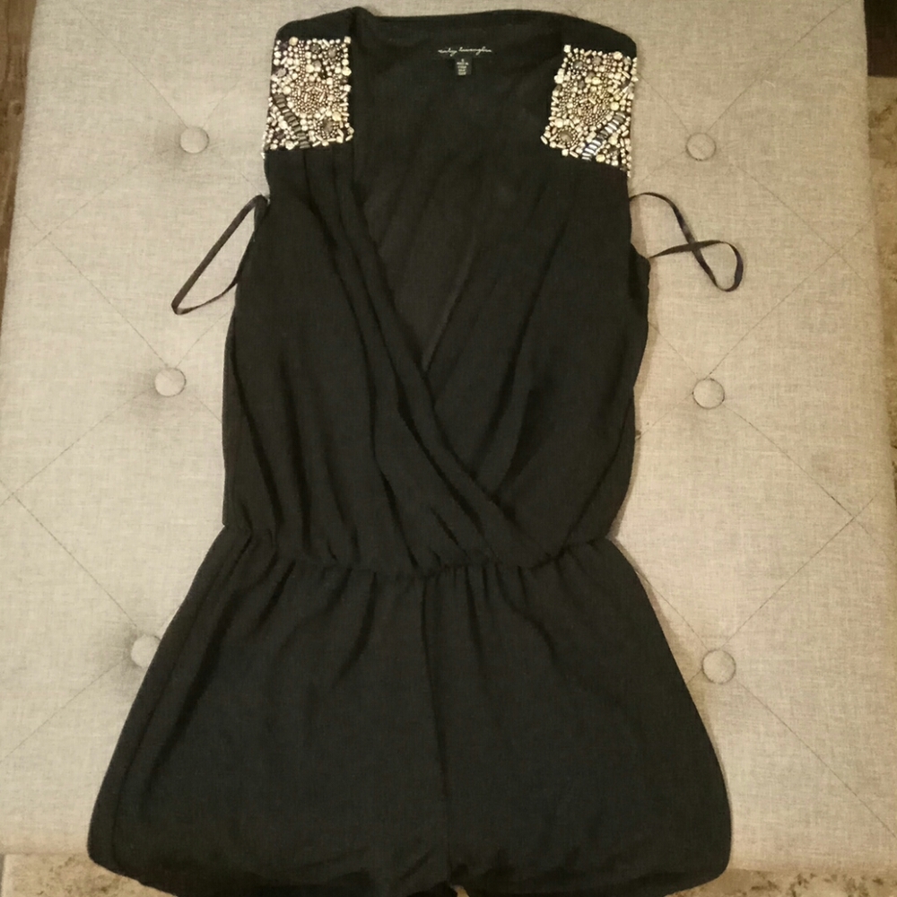 Jumpsuit with Jeweled shoulder detail.